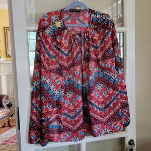 blouse featuring a dynamic mix of geometric and abstract patterns